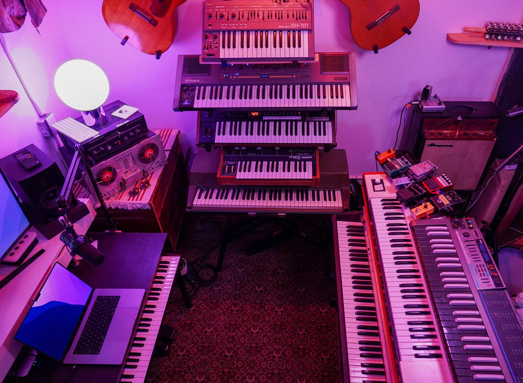 Roland SH-101, Juno, Prophet 6, Moog Prodigy, Wurli 200A, Pedals, Amp, Korg Poly 800, Hohner Clavinet, Rhodes Suitcase 73 and a MIDI controller under the desk!
